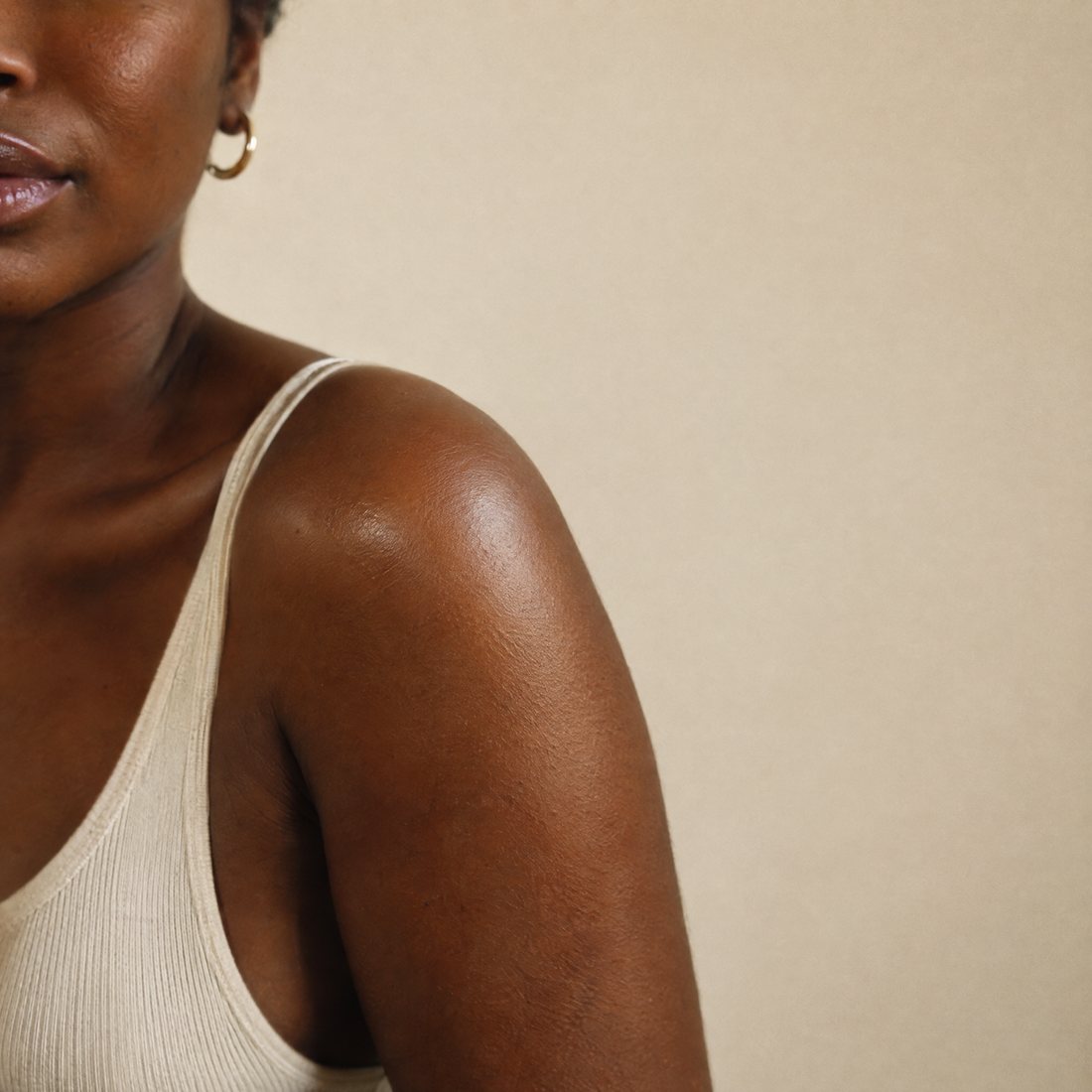 Close-up of well-moisturised skin on a shoulder