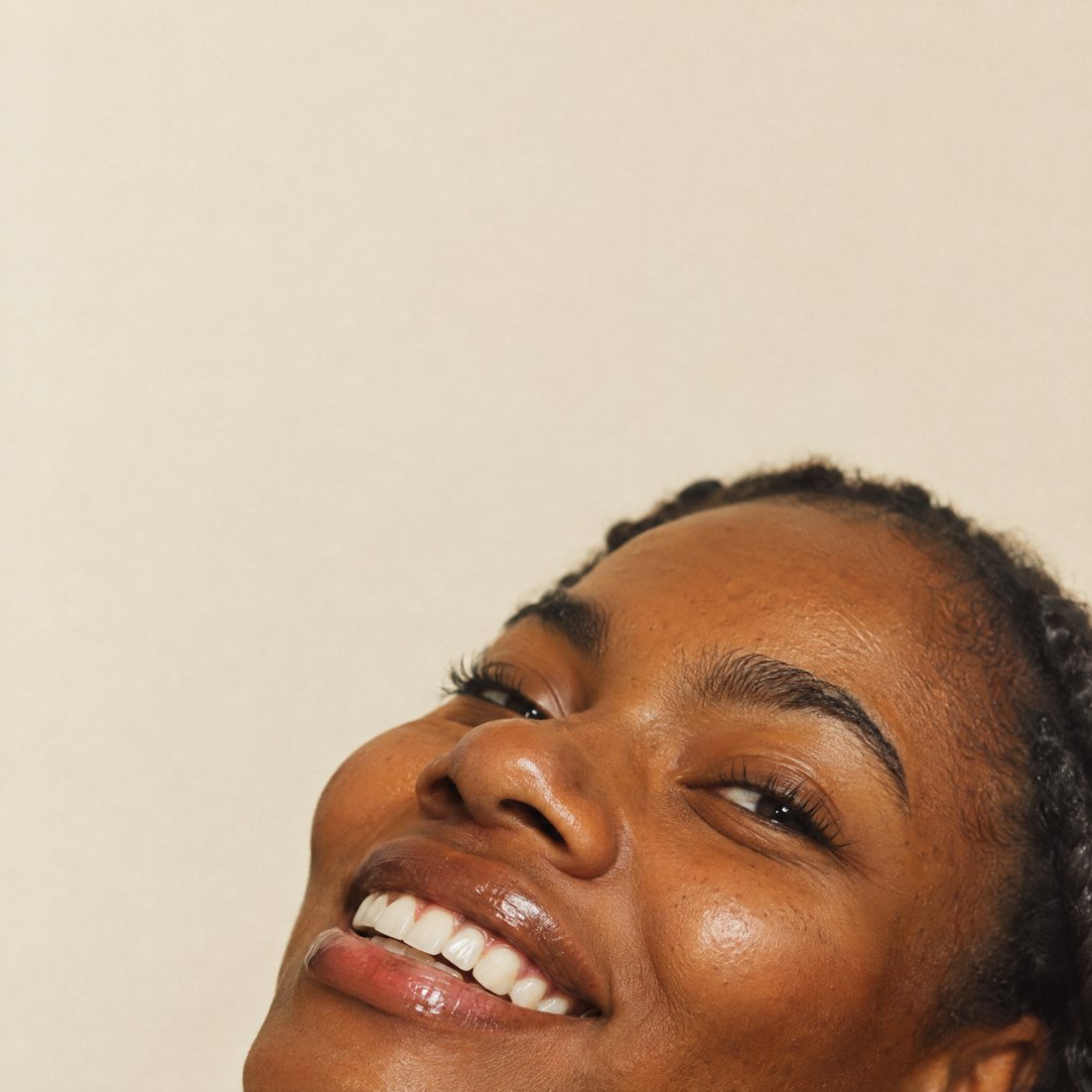 Close-up of a smile with soft, naturally glossy lips
